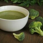 broccoli almond soup in white color bowl.