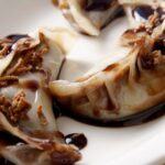 chocolate momos in white color plate.