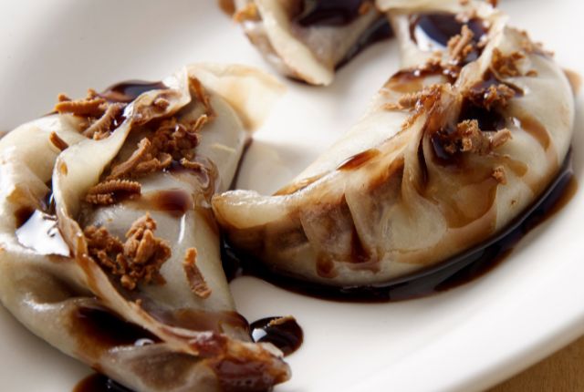 chocolate momos in white color plate.