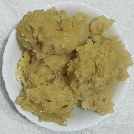 khichu in white color bowl.