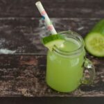 cucumber juice in jar with straw.