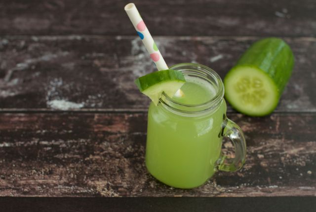 cucumber juice in jar with straw. 