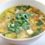 veg lung fung soup in white color bowl.