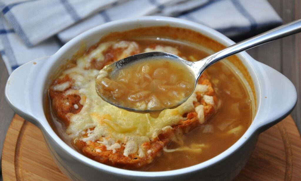 french onion soup in white color bowl.