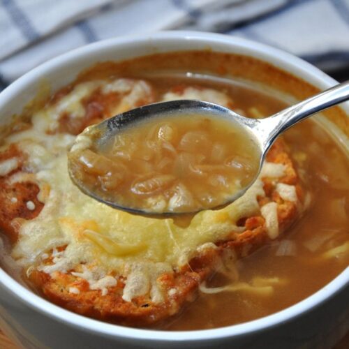 french onion soup in white color bowl.