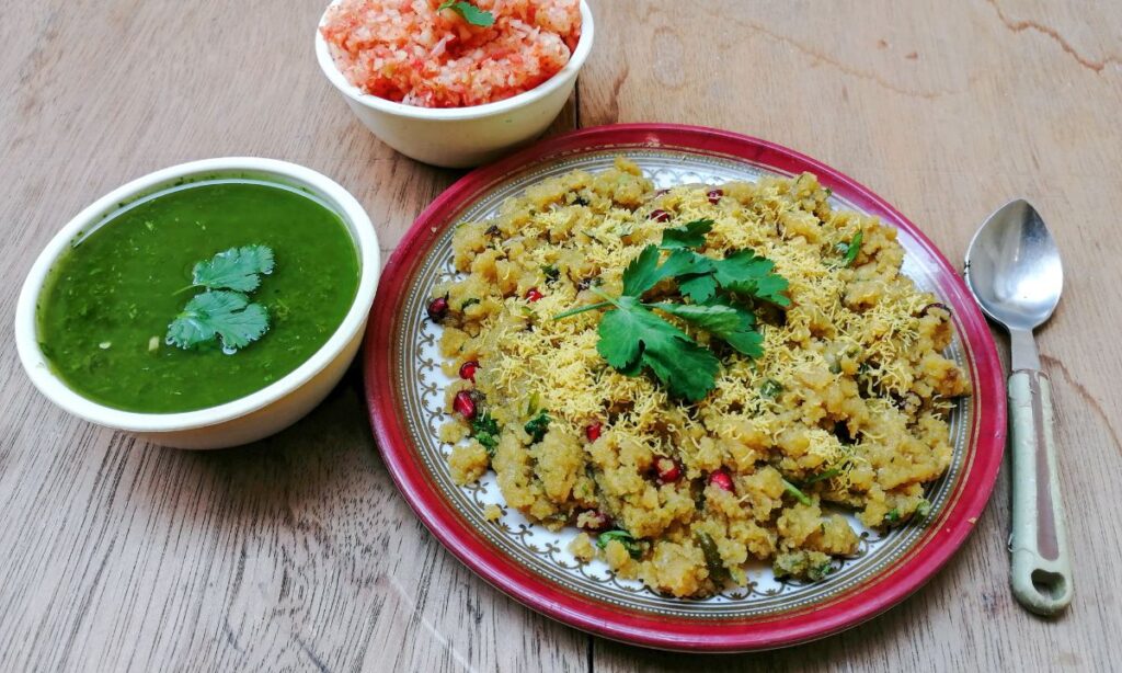 sev khamani in plate and green chutney in white color bowl. 