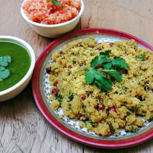 sev khamani in plate and green chutney in white color bowl.