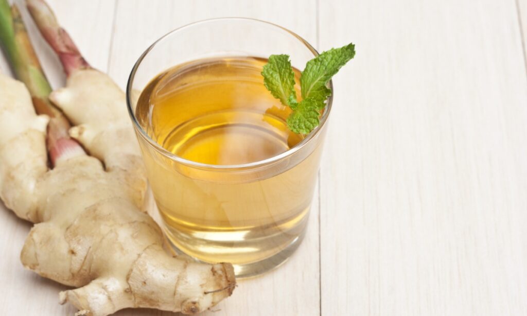 korean ginger tea in glass, ginger on the tableware.