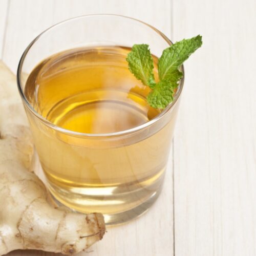 korean ginger tea in glass, ginger on the tableware.