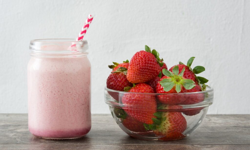 korean strawberry milk in the jar with straw.