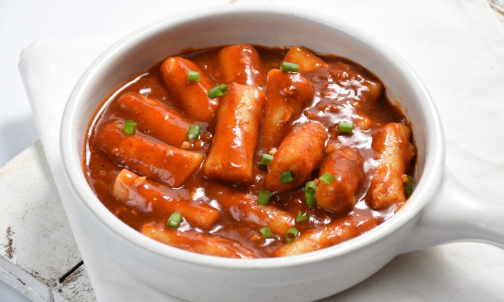 Rose Tteokbokki in white color bowl.