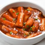 Rose Tteokbokki in white color bowl.