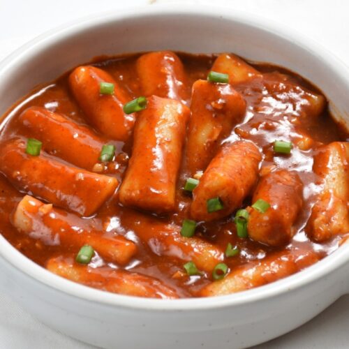 Rose Tteokbokki in white color bowl.