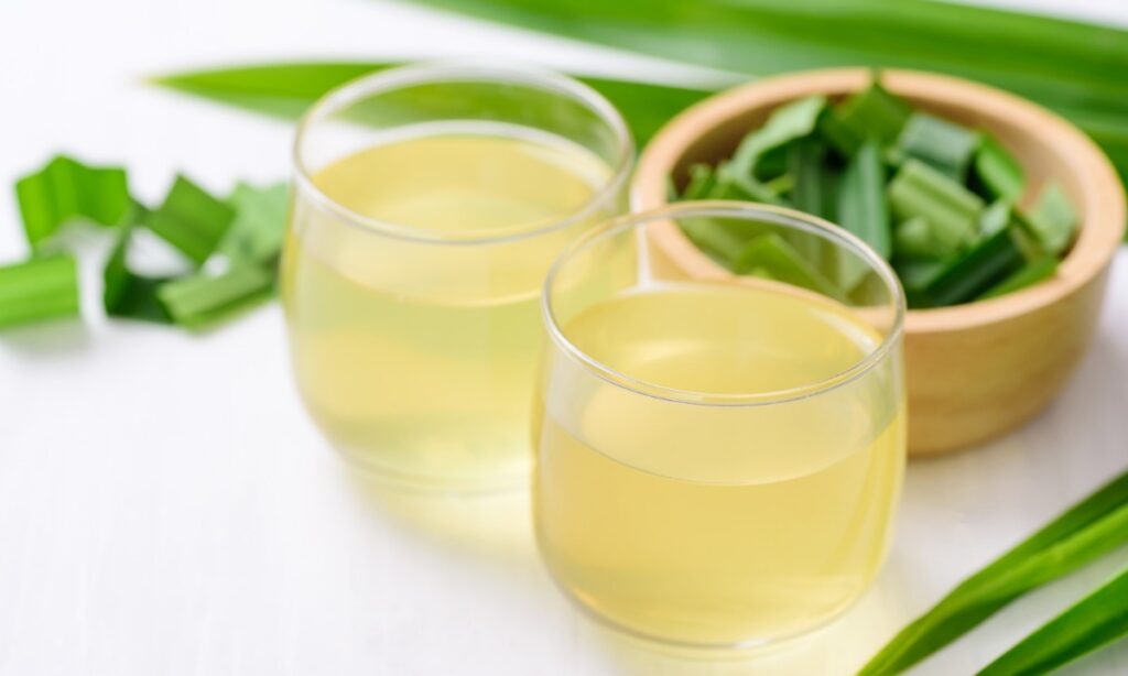 thai pandan drink in glass. pandan leaves on the tableware.