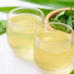 thai pandan drink in glass. pandan leaves on the tableware.