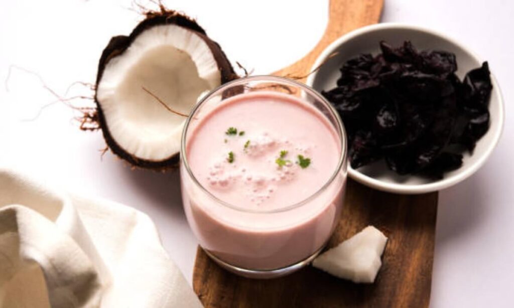 solkadhi in glass. coconut on the tableware.