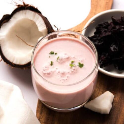 solkadhi in glass. coconut on the tableware.